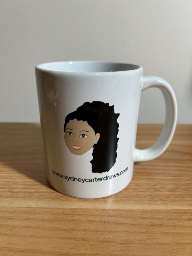 mug with Sydney Carter cartoon and website printed on it